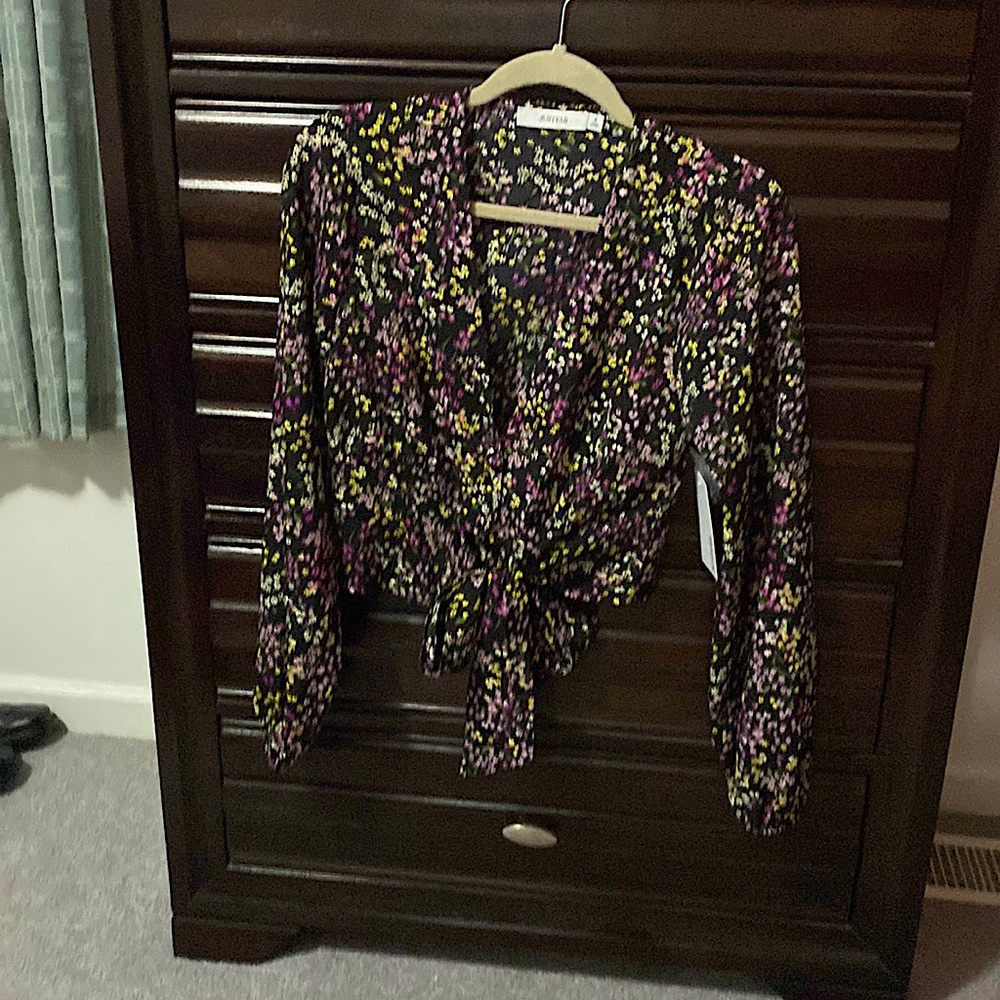 New black long sleeve crop top with white, lavender, rose, and yellow flowers